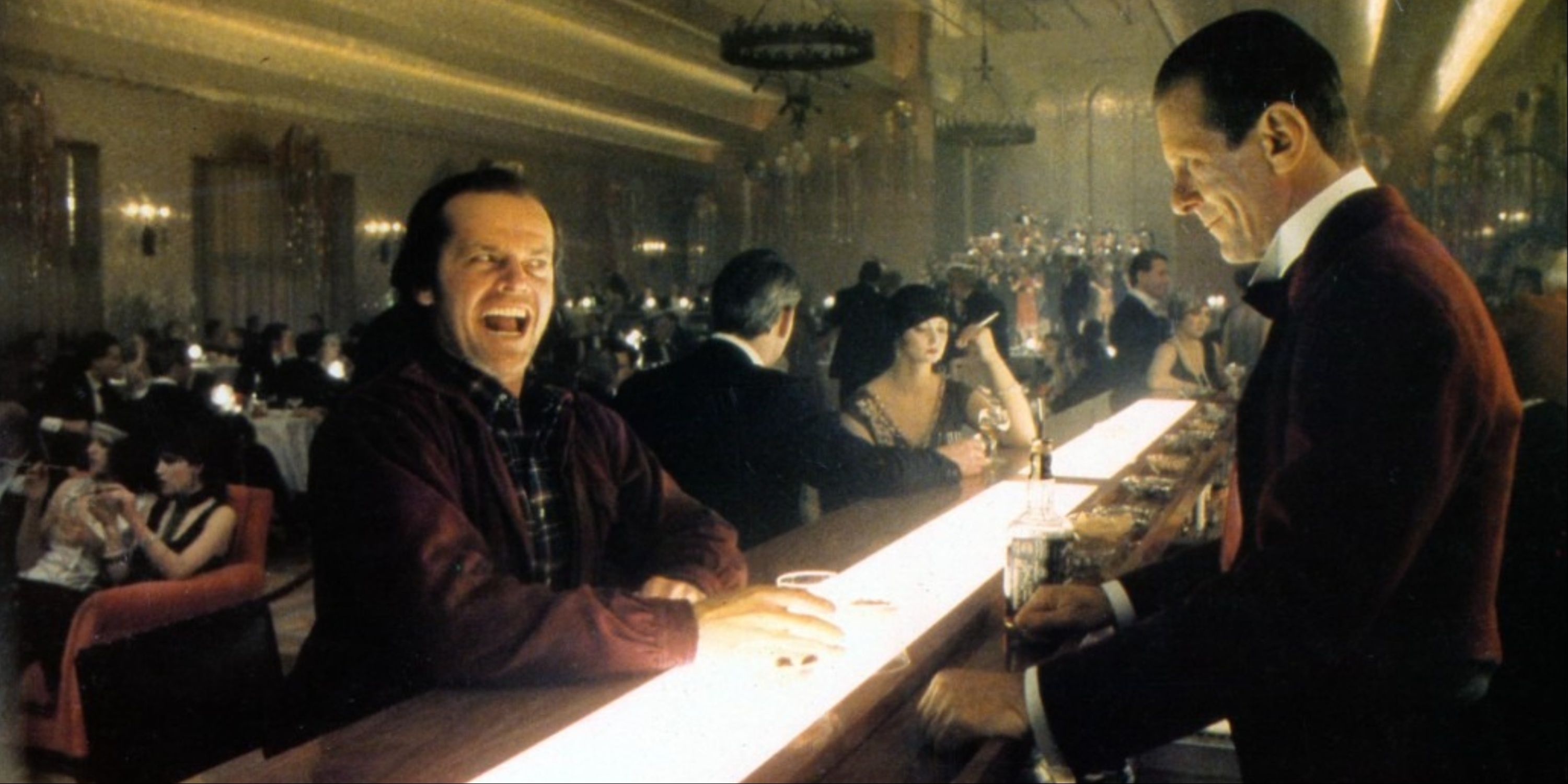 Jack Nicholson's Jack Torrance sitting at a bar with the flashback of hotel guests in The Shining.