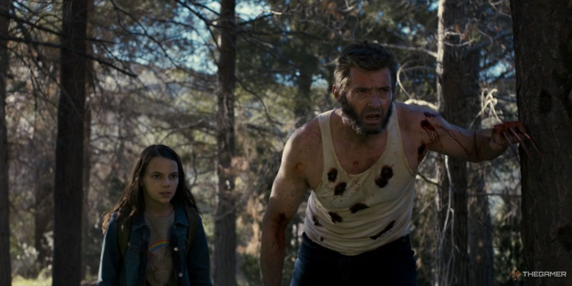 Wolverine and X-23 in a forest from Logan.