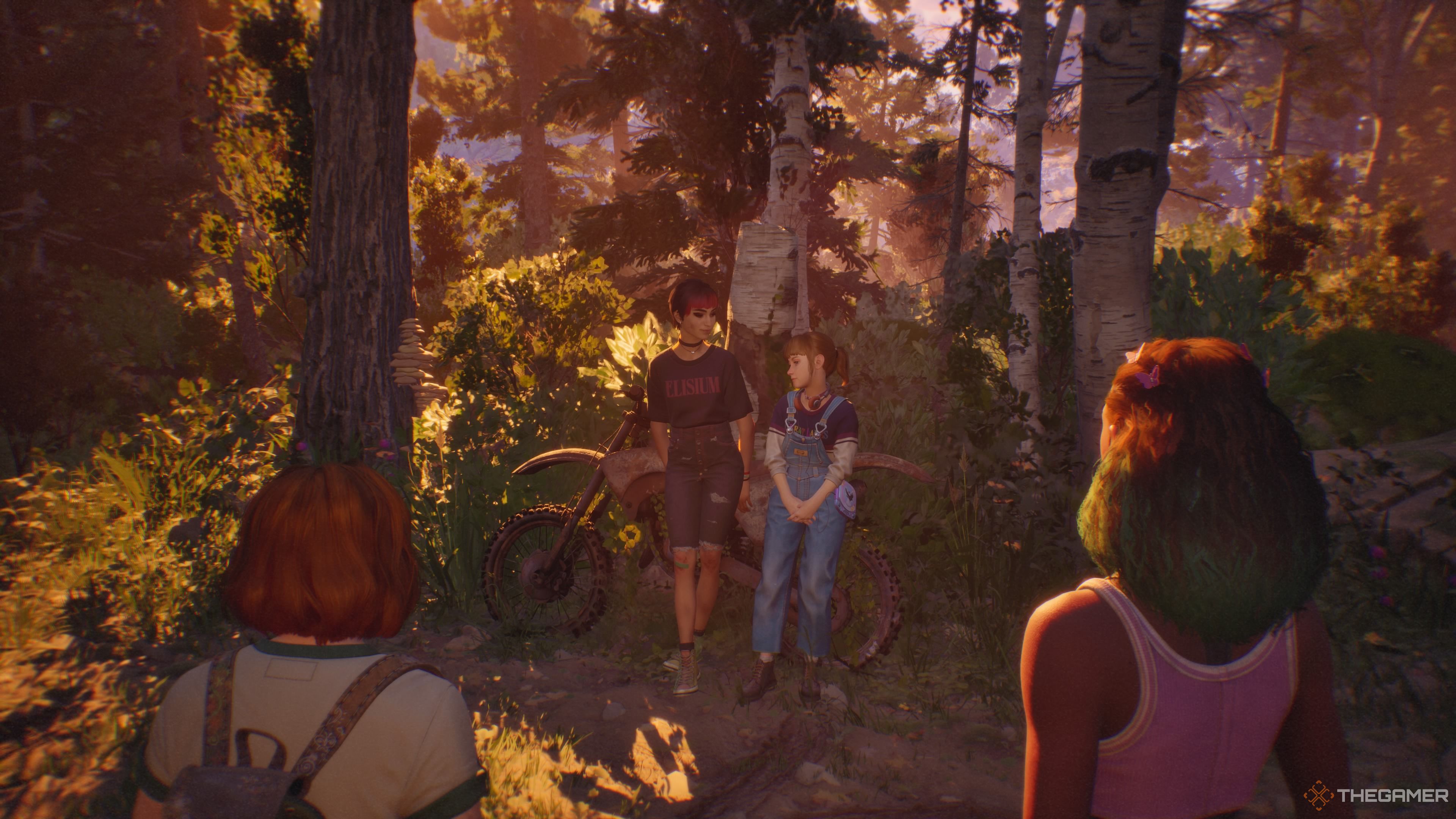 Nora and Kat sitting on a rusted motorcycle in Lost Records: Bloom & Rage as Swann and Autumn watch.