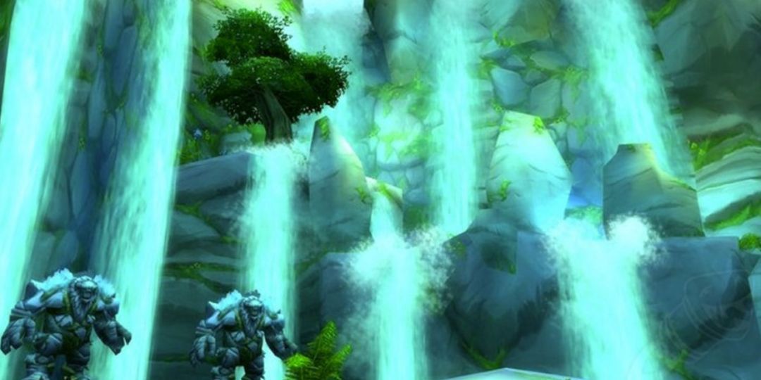 Two elementals stand in front of a waterfall in Maraudon.