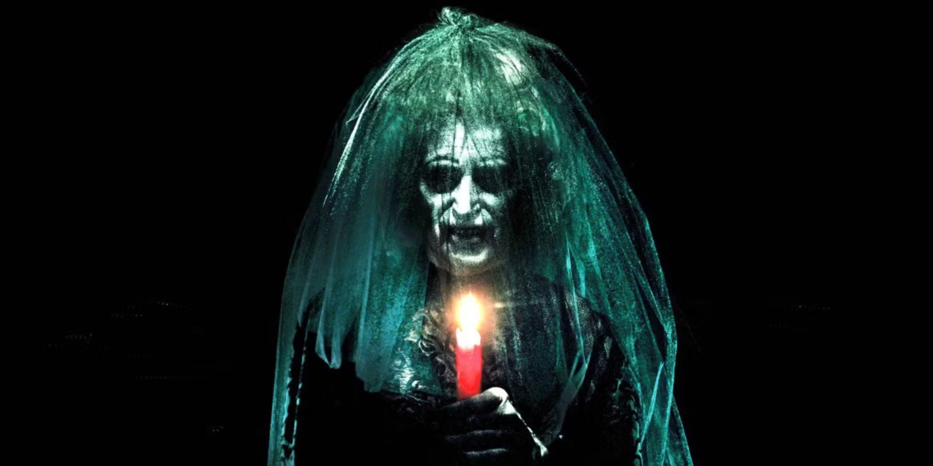 The Bride In Black holds a candle as she reveals herself.