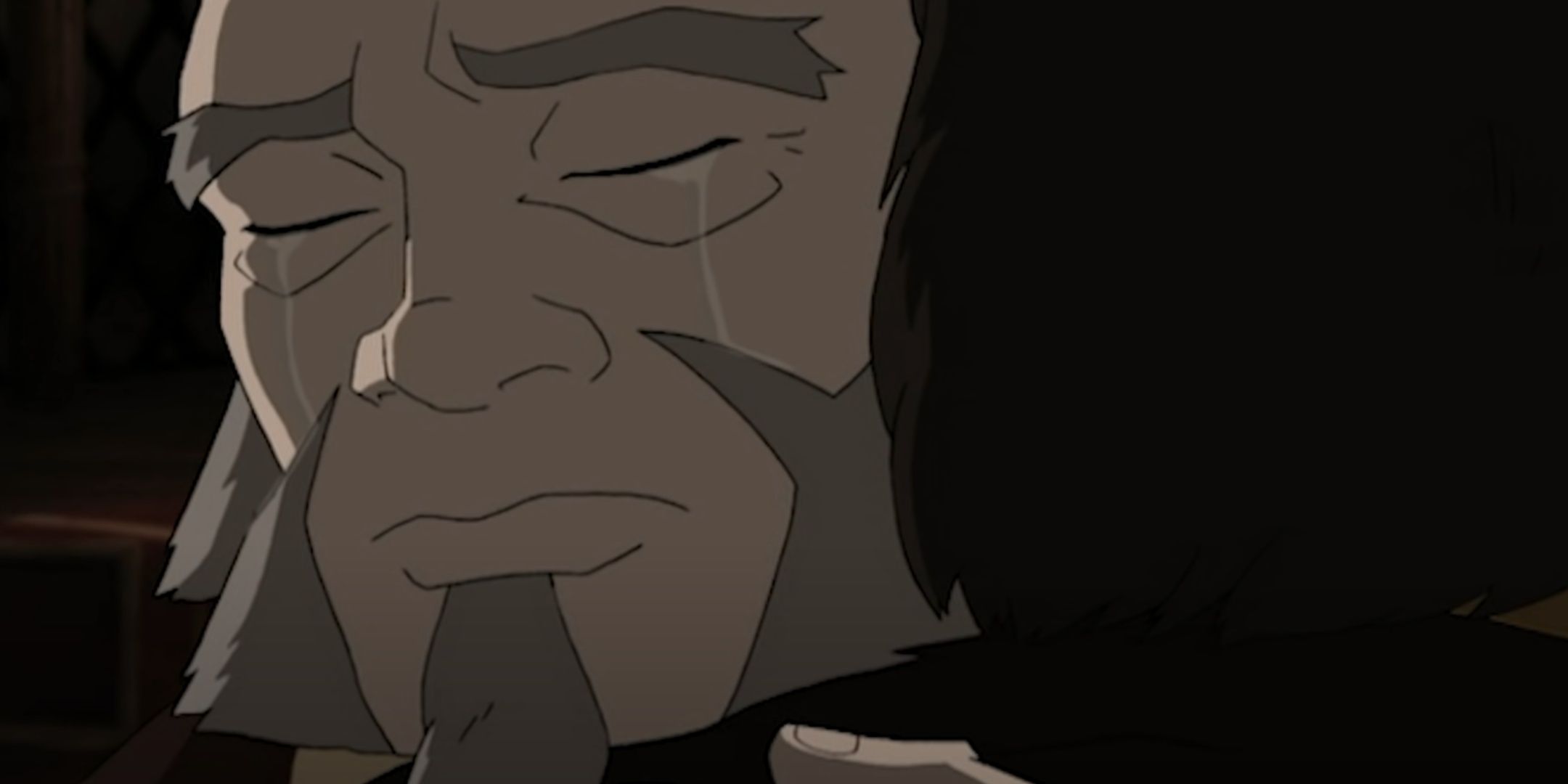 A crying Iroh hugs Zuko.