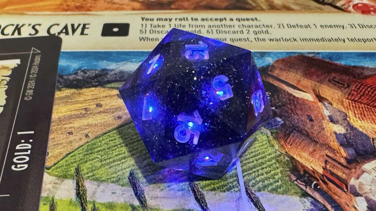 Pixels dice illuminated purple