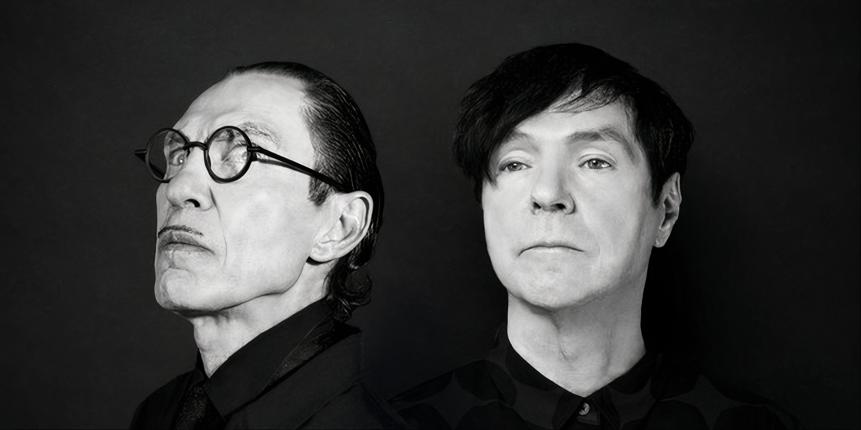 Ron Mael Russell Mael in black-and-white as seen in Edgar Wright's The Sparks Brothers documentary.