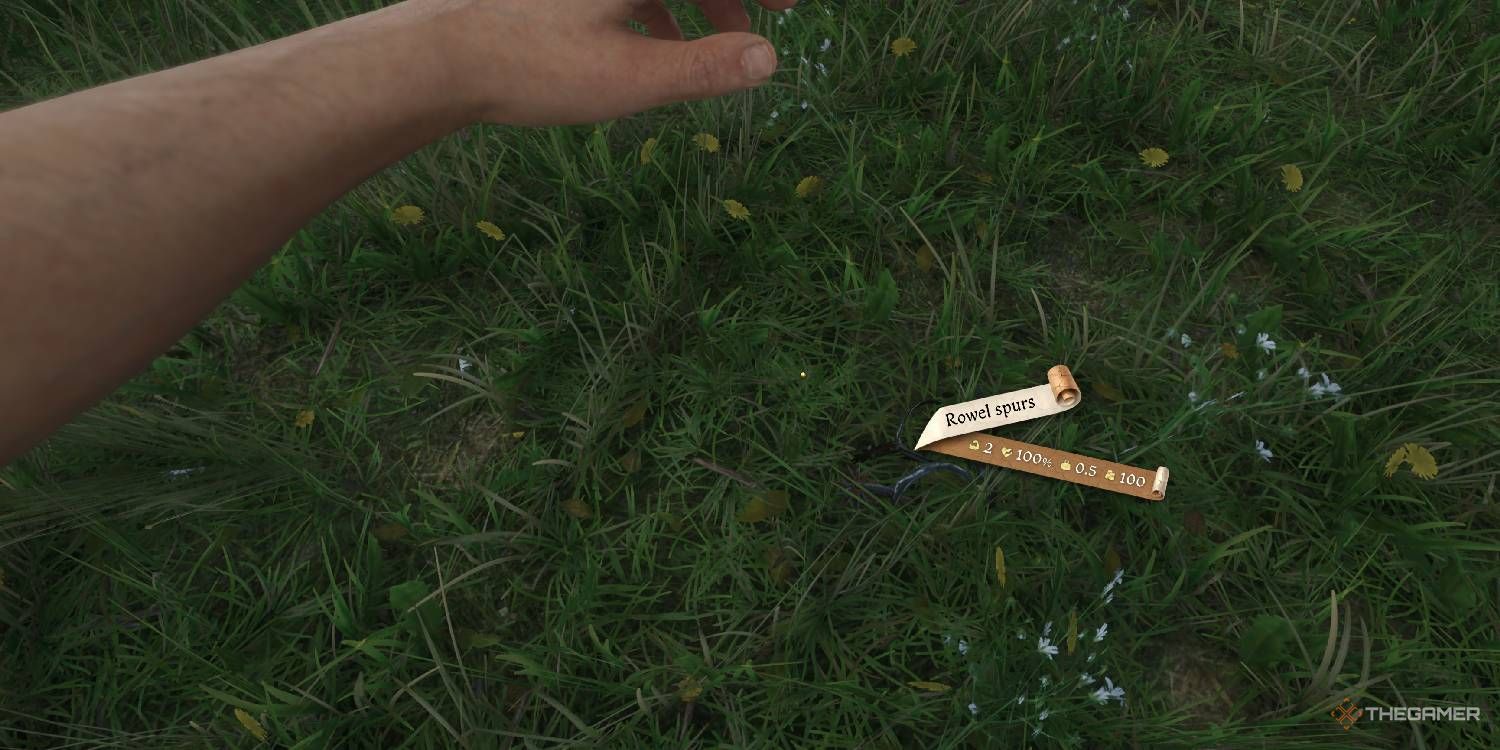 Rowel Spurs displayed in a field in Kingdom Come Deliverance 2.