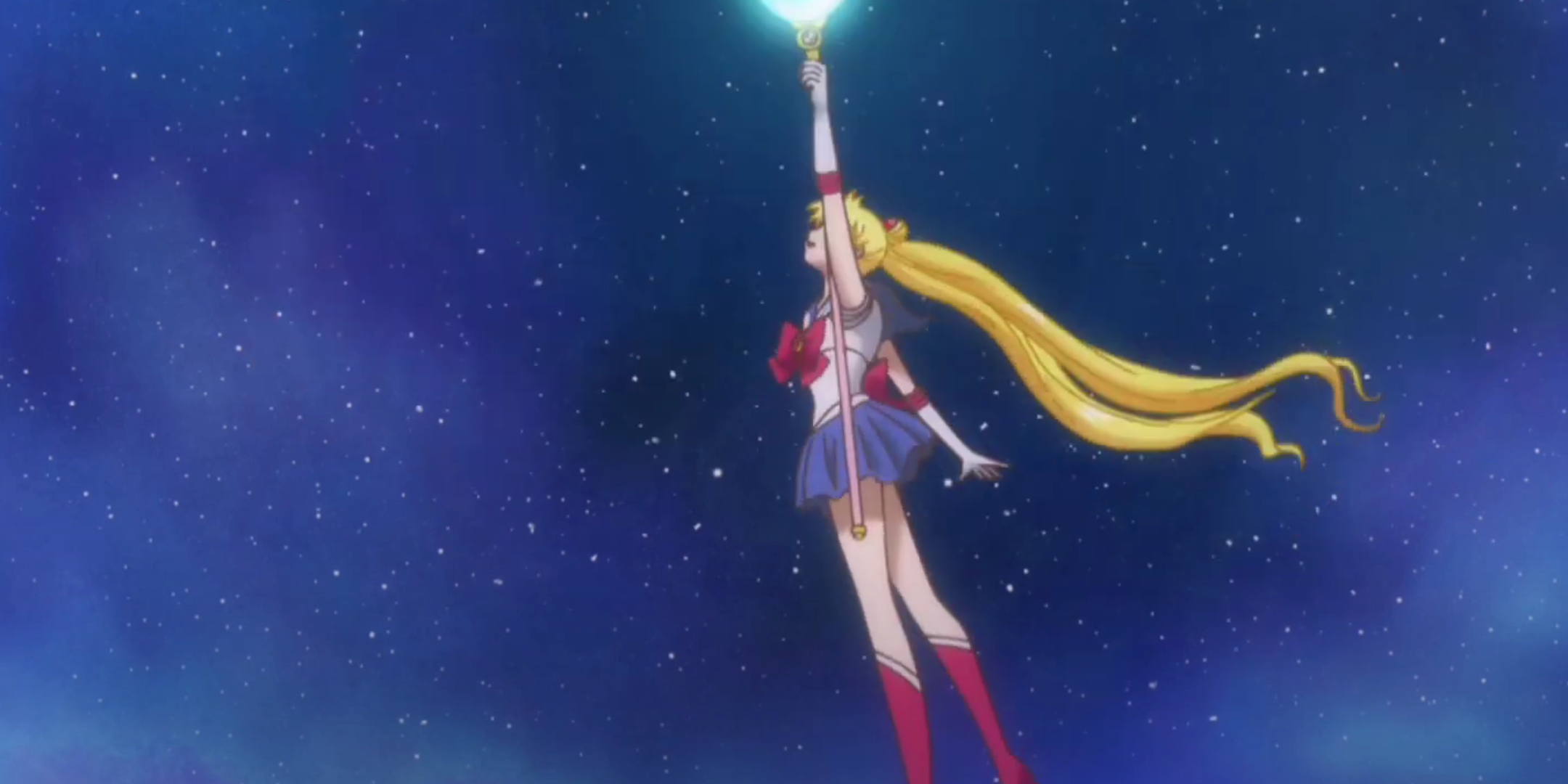 Sailor Moon has raised her wand to cast Moon Healing Escalation.
