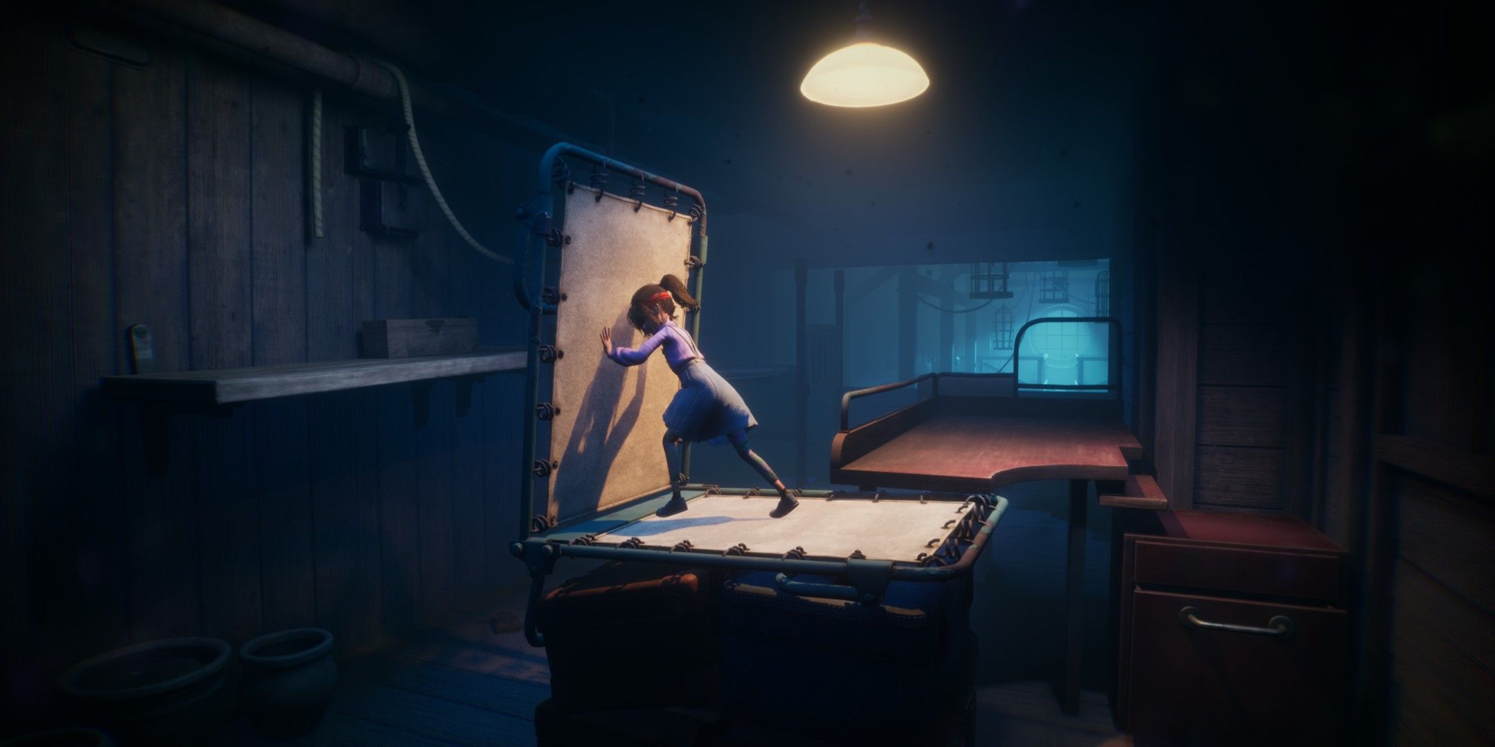 Sophie pushes a cot over to form a bridge in Out of Sight.