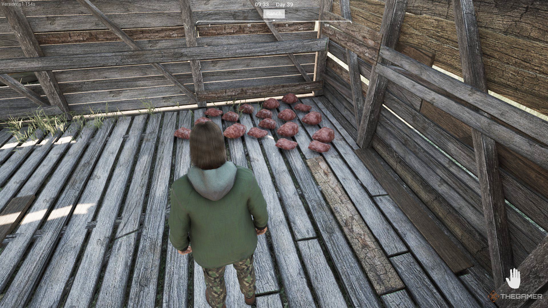 The player is standing next to some wild meats that are scattered on the wooden floor of a cabin in Ranch Simulator