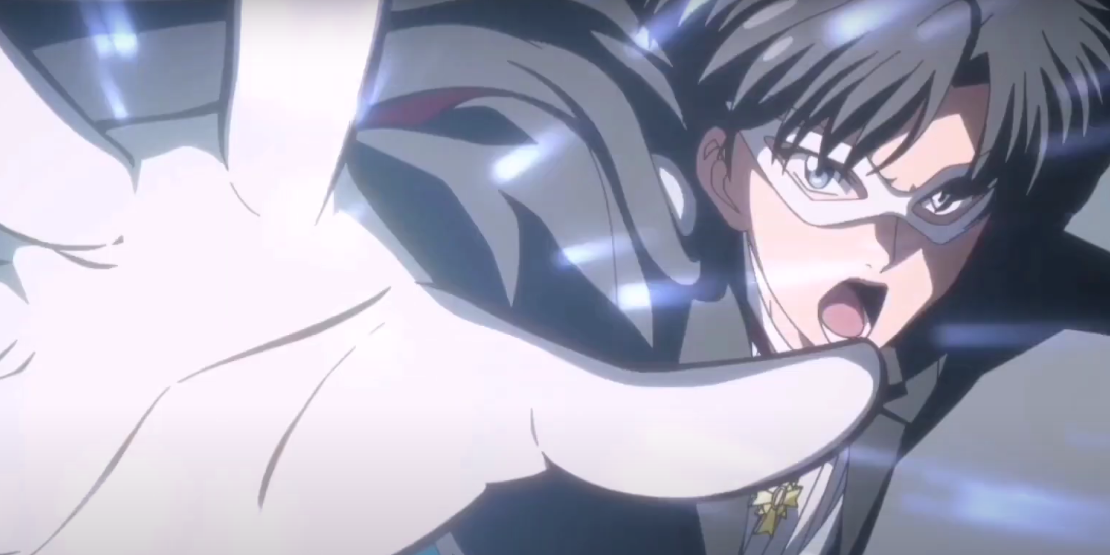 Tuxedo mask about to fire Tuxedo La Smoking Bomber from his hand in Sailor Moon.