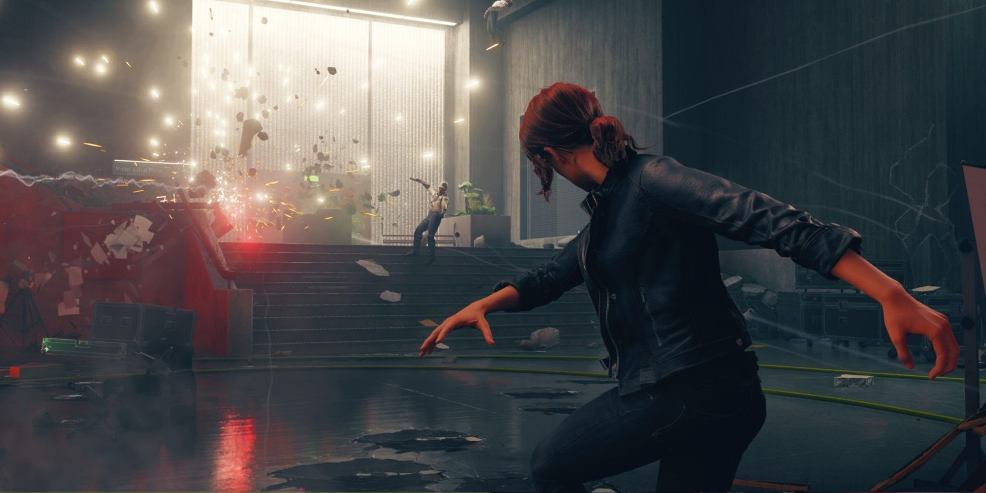 Remedy's game Control showing Jesse using powers on the environment with security guards flying from a blast.