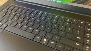 Close up on Razer Blade 16 keyboard with orange backlighting