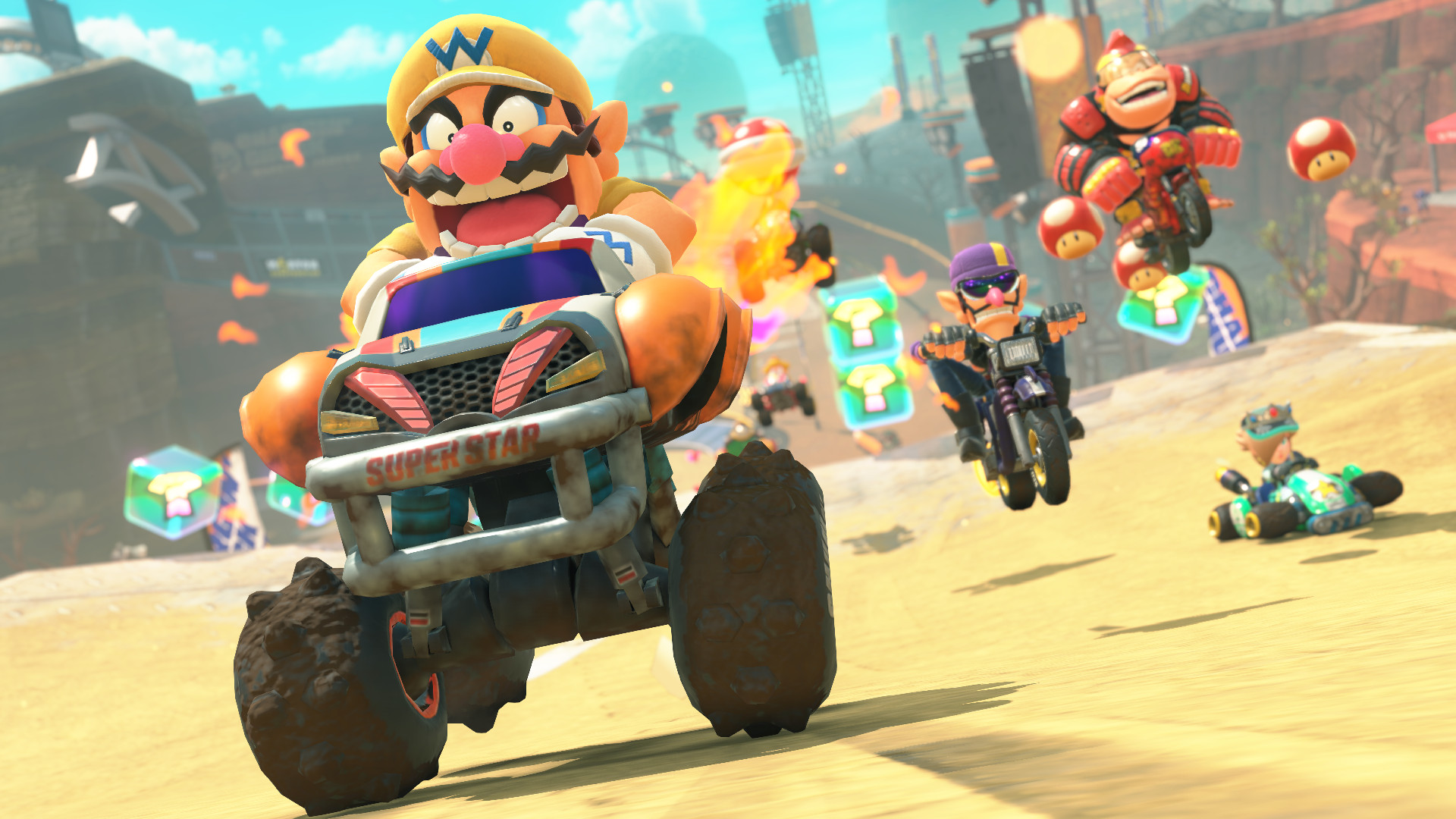 Mario Kart World screenshot for Switch 2 shpwing Wario blasting ahead with a host of characters right behind him in a desert biome