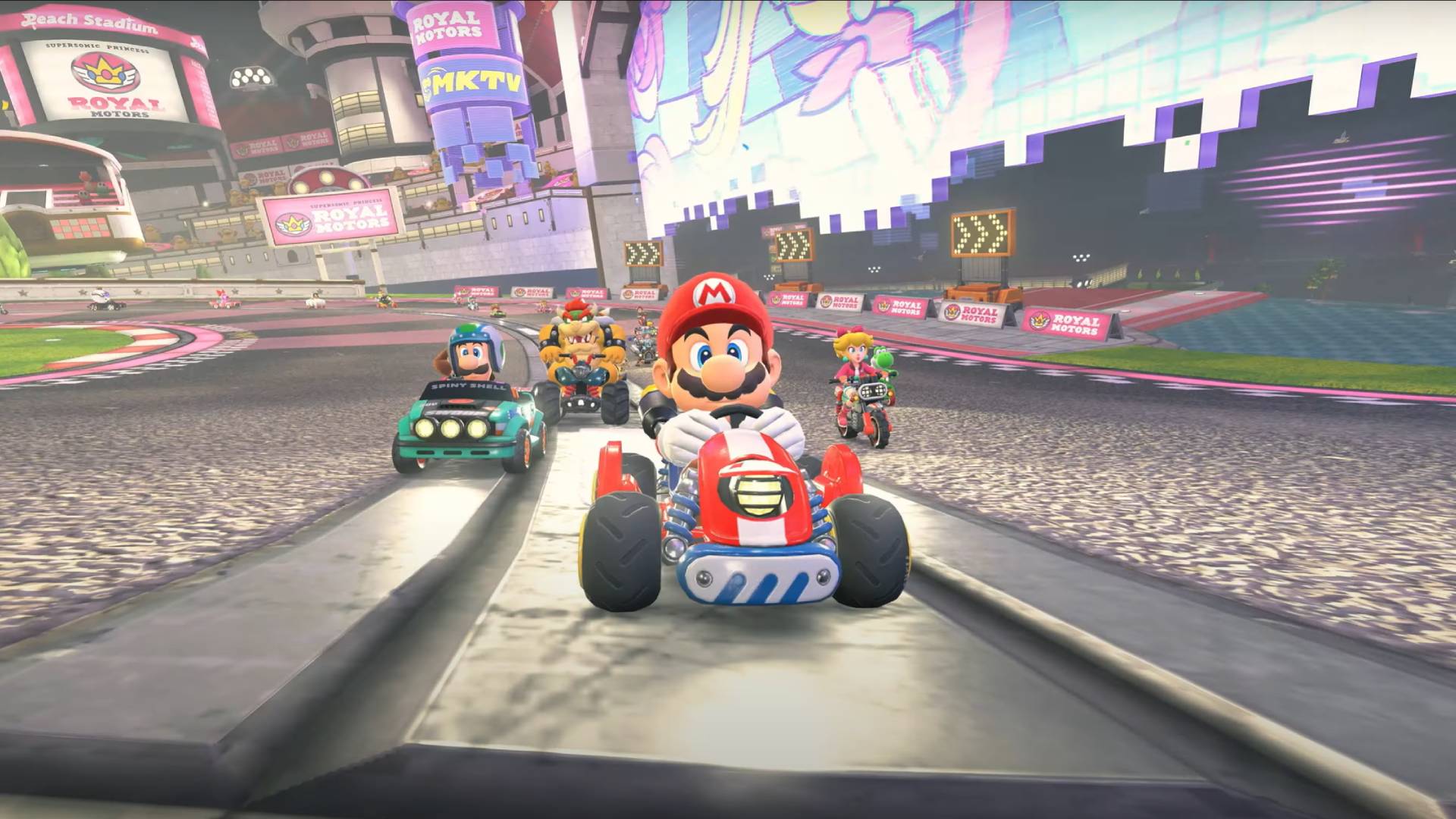 Screenshot from Mario Kart World's reveal trailer showing Mario, Luigi, Bowser, and Peach racing.