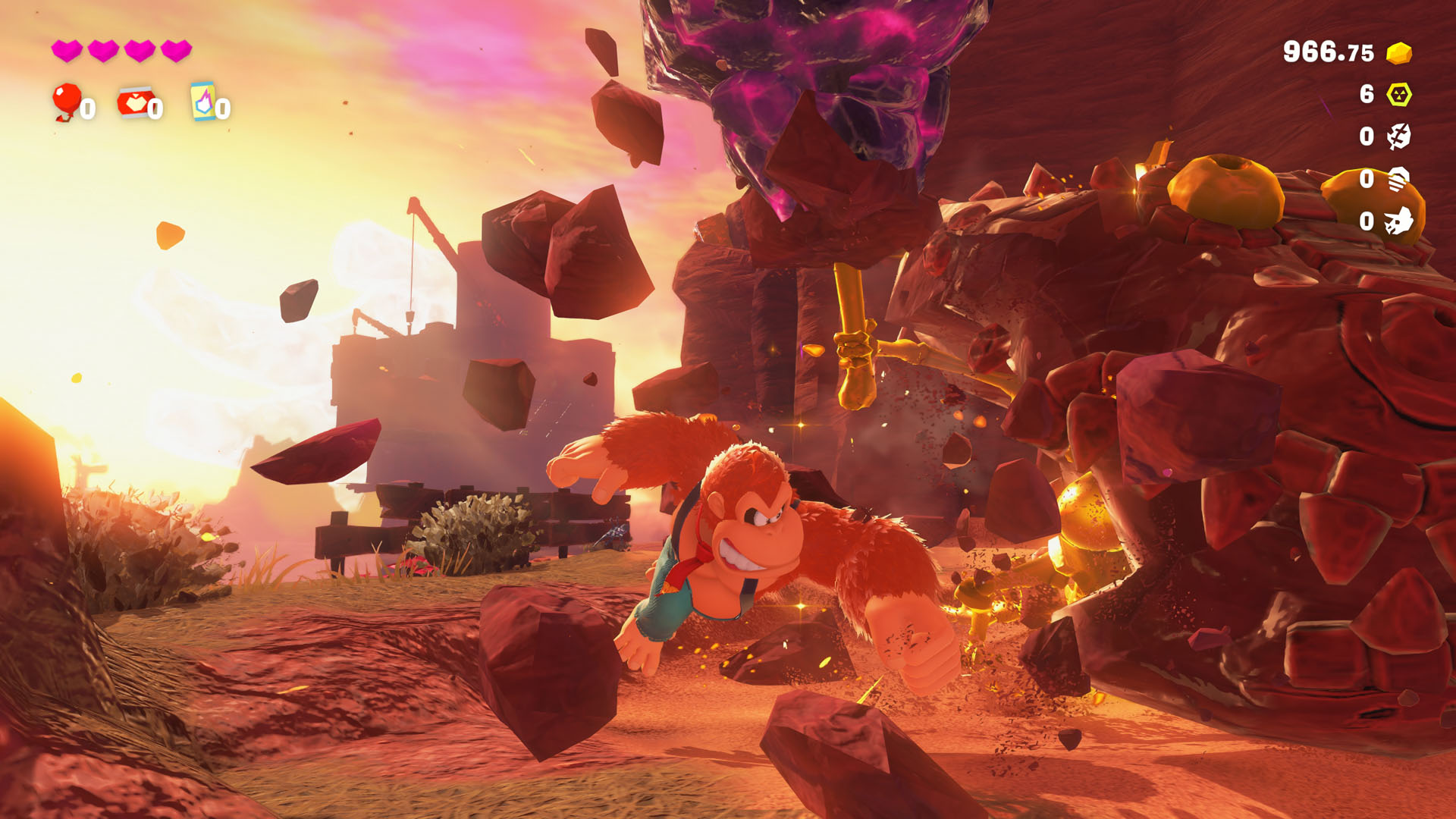 Donkey Kong smashes through rocks on a mountain in Donkey Kong Bananza as the sun sets behind him