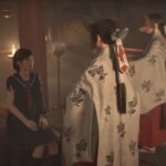 Hinako Shimizu sitting in a shrine with two masked woman approaching her during the reveal trailer for Silent Hill f.