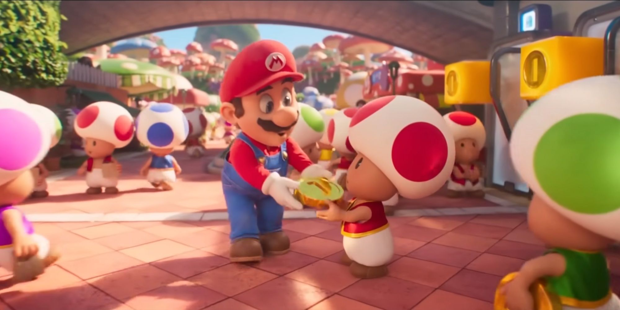 mario giving a red toad a coin in the super mario bros movie.