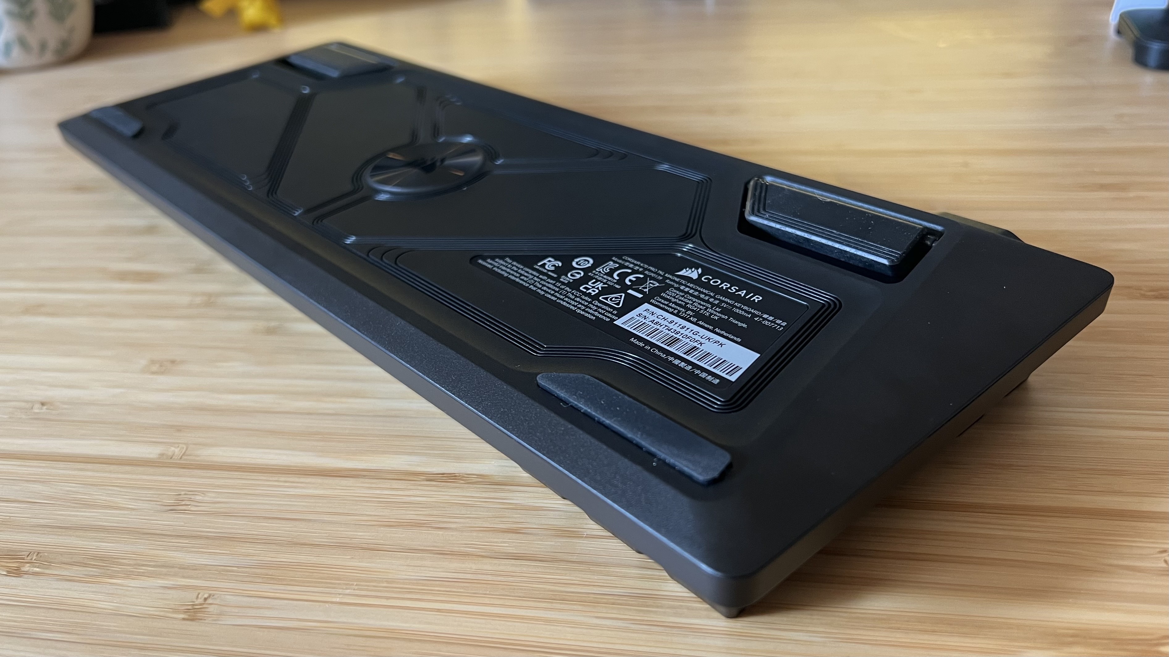 Underside of Corsair K70 Pro TKL gaming keyboard showing slight elevation of the main chassis