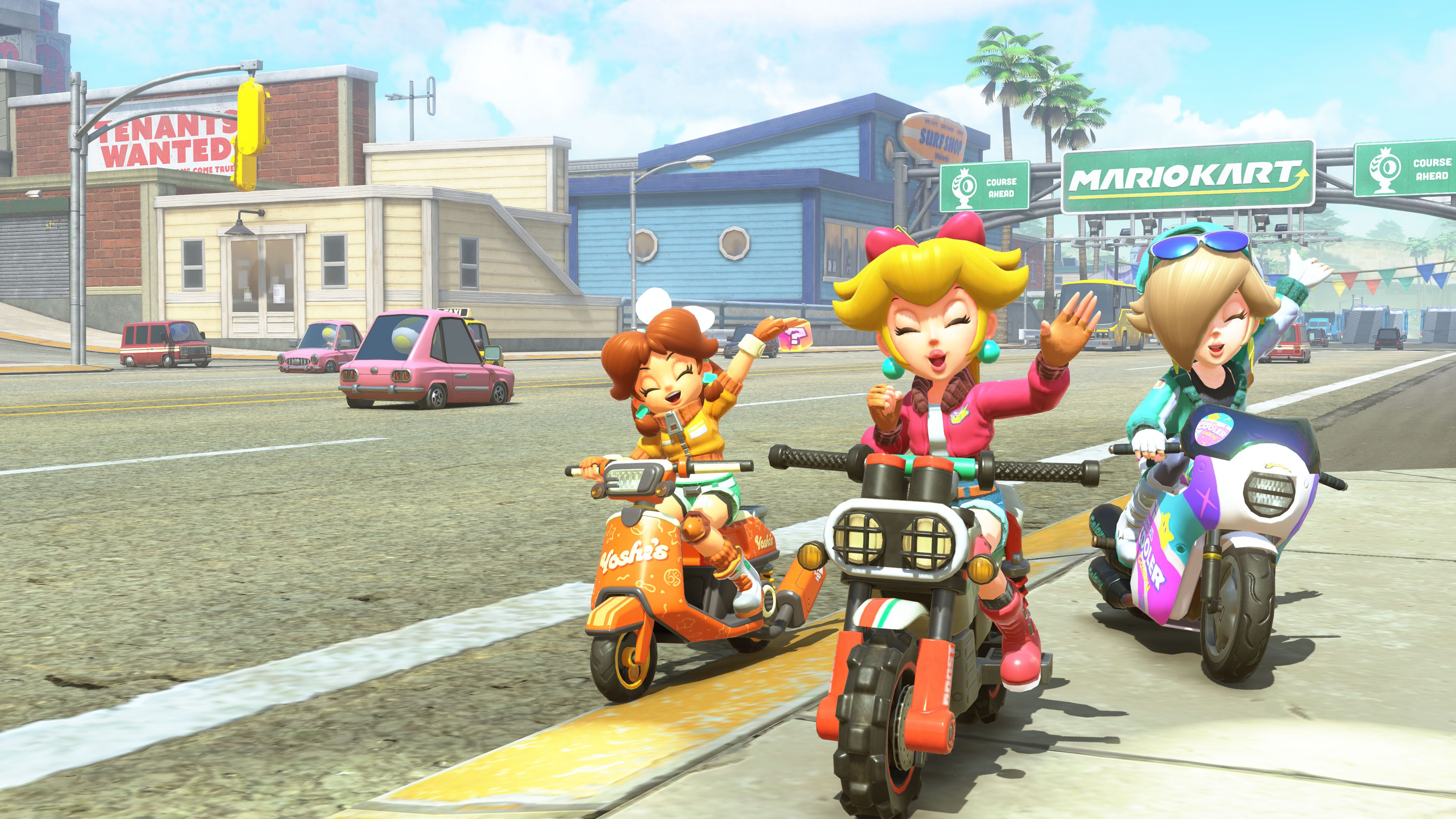 Daisy, Peach, and Rosalina pose in photo mode in Mario Kart World. 