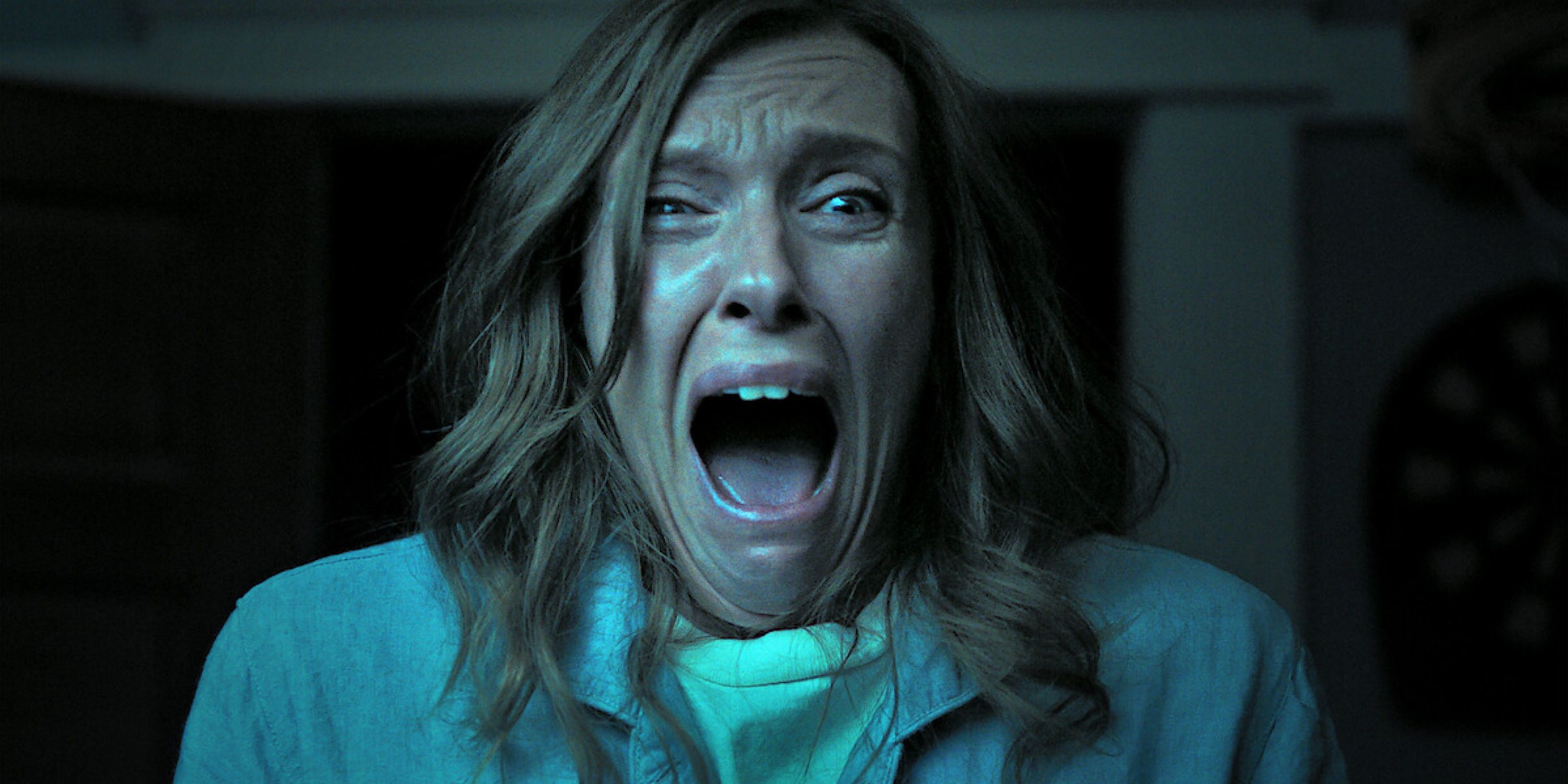 Annie Graham screams in horror.