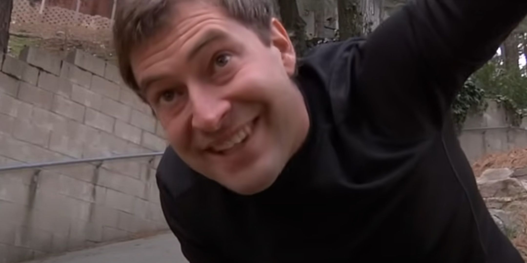 A smiling Josef appears before Aaron.