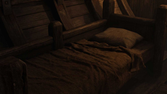A bed in a dark room in Oblivion Remastered.