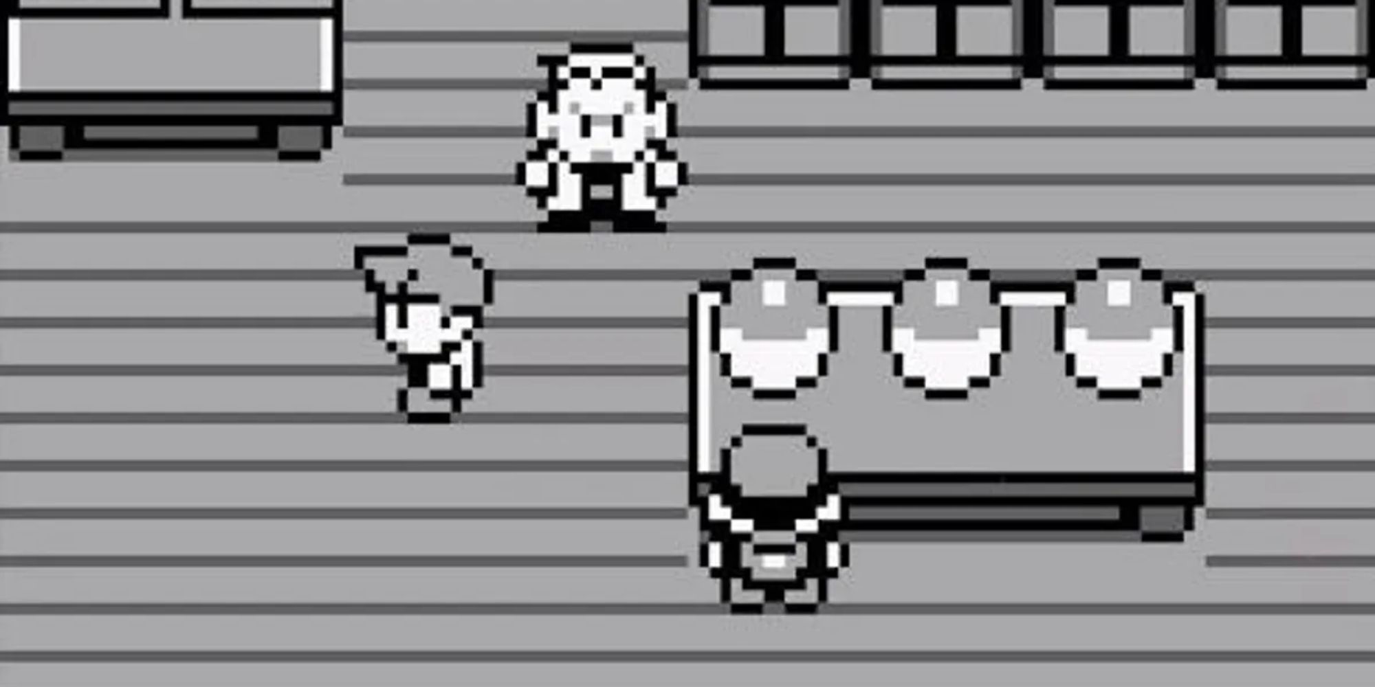 Pokemon Red screenshot of the player stood next to the table that contains three Pokeballs.