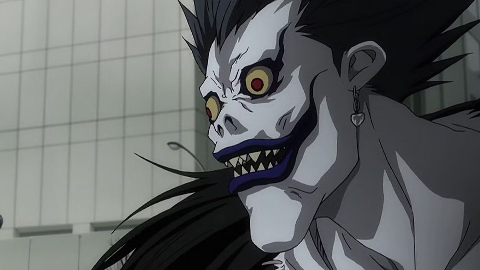 Ryuk from Death with a creepy smile on his face.