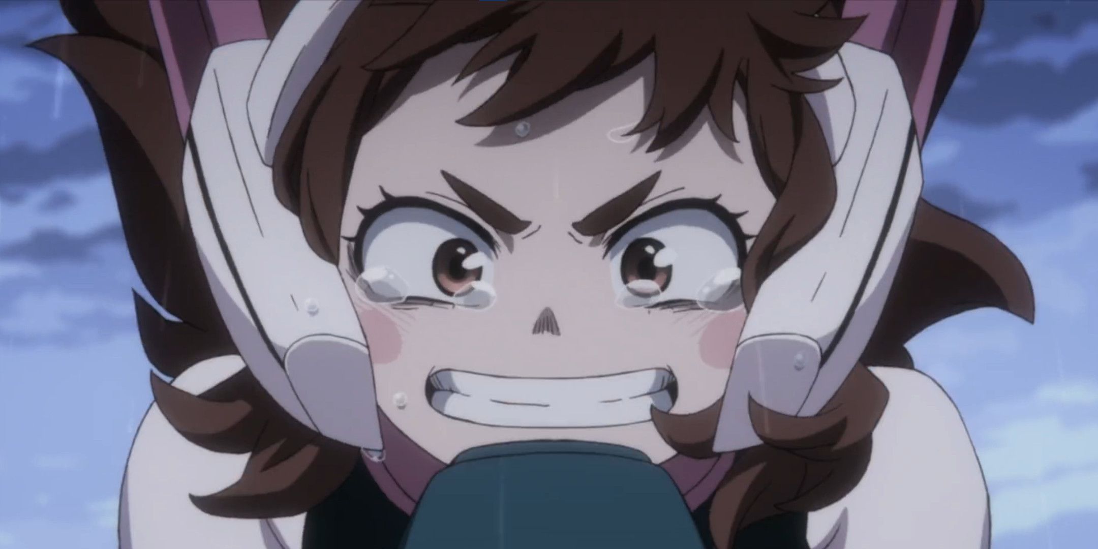Uraraka from My Hero Academia holding a loudspeaker with tears in her eyes.