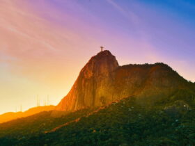 The famous statue Christ the Redeemer atop the mountain Rio