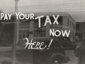Pay your tax here now written on a window