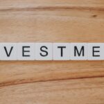 Investment spelled out in scrabble-esque tiles