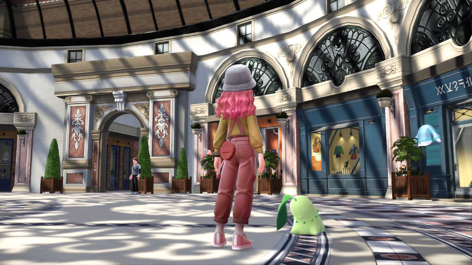 A screenshot of a pink-haired trainer and a sleepy Chikorita outside a clothing shop in Pokemon Legends: Z-A.