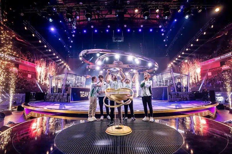 Team Falcons lifting trophy at The International