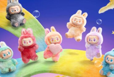 Multi-colored Labubu dolls jumping and sliding on rainbow surfaces in a space-like scene