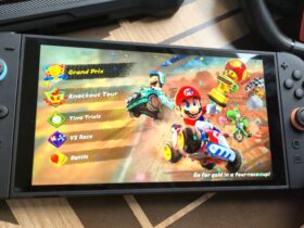 Photo by Rosalie Newcombe of the Nintendo Switch 2 sitting on a coffee table surrounded by accessories.