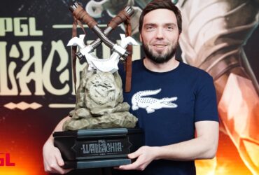Korb3n holding PGL Wallachia Dota 2 trophy