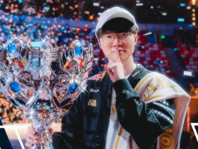 T1 team celebrates their League of Legends LCK championship victory on stage with the trophy