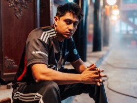 Dhokla posing in 100 Thieves jersey
