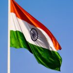 india flag flying with blue sky in background